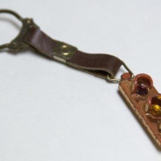 Plastic key ring on a leather strap