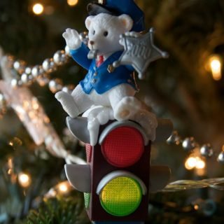 Photo of a Trevco Trading Corp "White Traffic Policeman Bear Sitting on a Traffic Light" Christmas Ornament