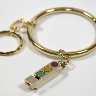 Key ring with metal hoop and whistle traffic light