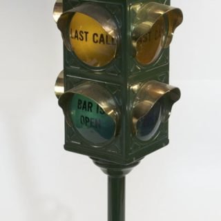 Photo of a B&B Bar/Pub aluminum traffic light works off 120 volts. Knob on base selects light. There were two variations in which the knob was different and the back opened towards the side or flipped downwards.