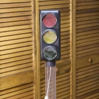 Plastic lighted bank with three randomly flashing 120-volt bulbs