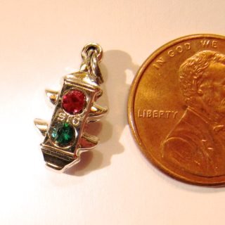 Sterling silver bracelet charm with STG mark
