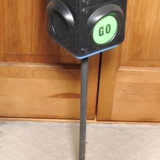 Plastic blow-mold rotating signal. Bell dings when signal is rotated each turn