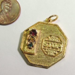 Gold-tone charm says “I’ll never stop loving you”