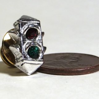 Silver plated pin with red and green rhinestones