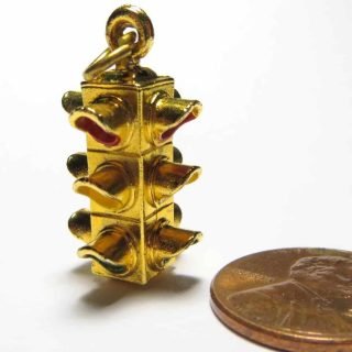 Gold-tone fixed 4-way charm