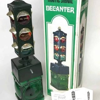 Lighted battery-operated push-button motorized Traffic Signal Decanter and dispenser