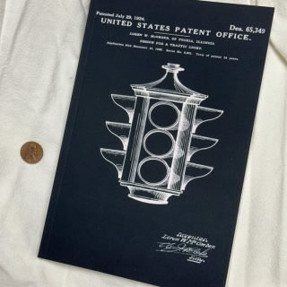 Empty notebook with a patent for a traffic signal on the cover